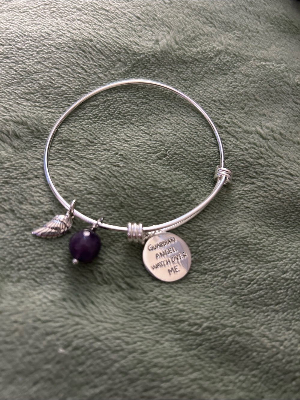 Footnotes:Guardian Angel Silver adjustable Bangle with Purple Bead Charm
